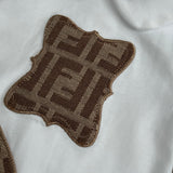 Baby’s Brown Inspired Sleepsuit & Bib Set